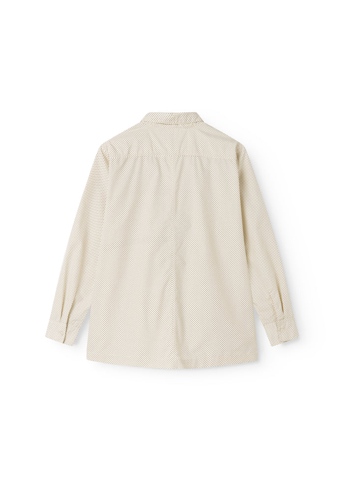 Off-white shirt with small black dots, collar and button closure, view from behind.