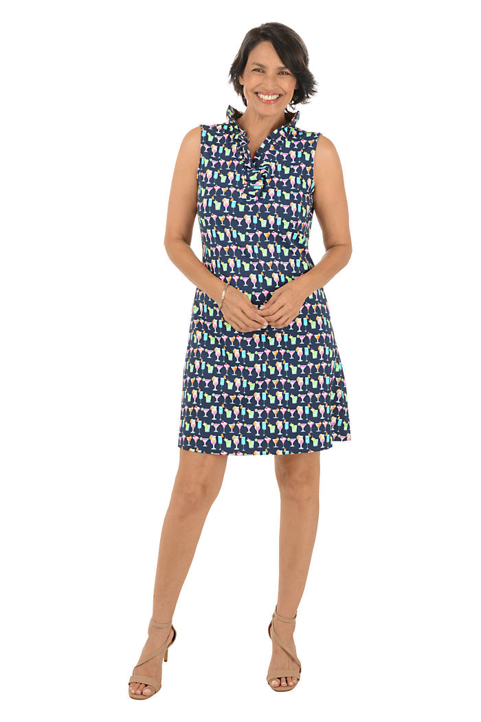 Woman wearing a patterned sleeveless dress on a white background.