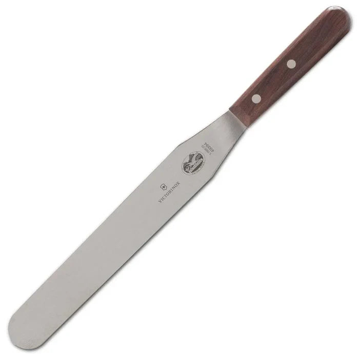 A Victorinox spatula with a stainless steel blade and dark wood handle.