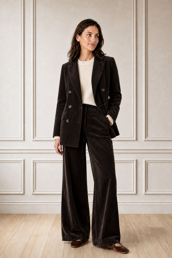 Model wearing the Aspiga Wide Leg Chunky Corduroy Trouser in Chocolate Brown, a high-waisted wide-leg corduroy trouser with patch pockets, alternate view