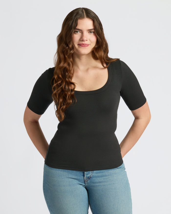 Woman wearing Womens Black Ribbed 3/4 Sleeve Scoop Neck Tee. MODEL_INFO: Margaret is 5'10", wearing a size L