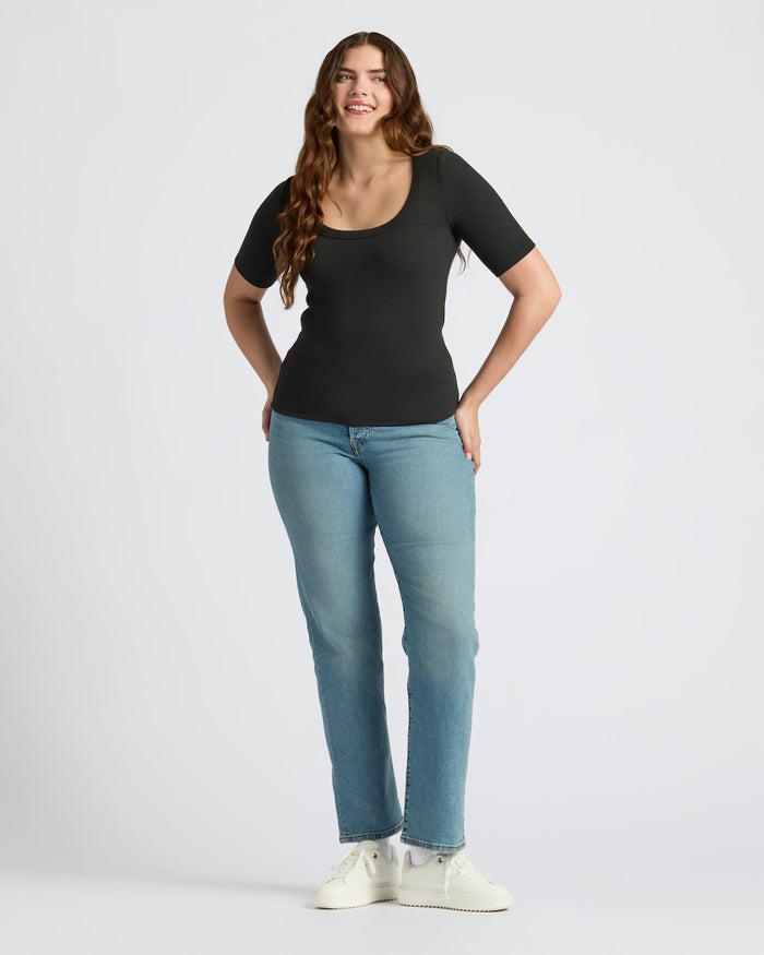 Womens Black Ribbed 3/4 Sleeve Scoop Neck Tee, paired with jeans.