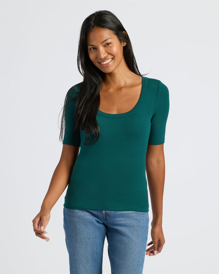 Woman in Womens Deep Emerald Ribbed 3/4 Sleeve Scoop Neck Tee.