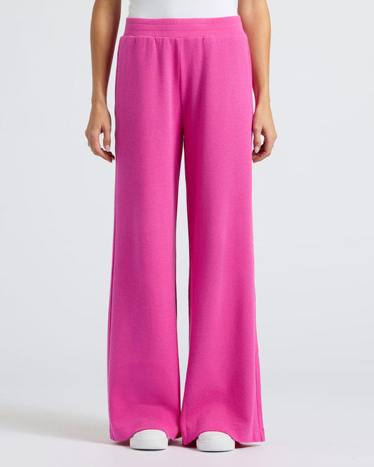 Womens Electric Fuchsia Waffle Leg Pant with white sneakers.