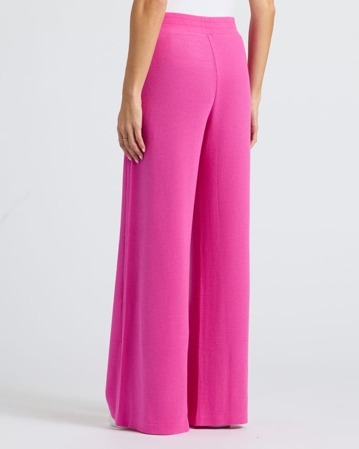 Womens Electric Fuchsia Waffle Wide Leg Pants modeled, showcasing textured fabric.