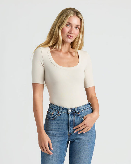 Woman in Women's Ribbed 3/4 Sleeve Scoop Neck Tee. MODEL_INFO: Cora is 5'10", wearing a size S