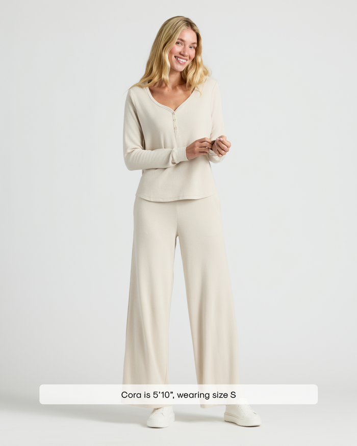 Model in Womens Oatmeal Waffle Wide Leg Pants with sneakers.